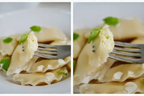 Pyszne pierogi z serem, jeden kęs na widelcu, ozdobione listkami mięty.